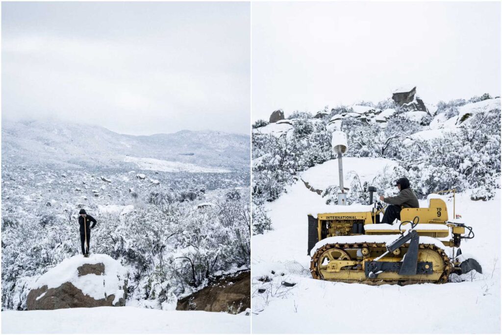 Man standing in the snow with shovel
