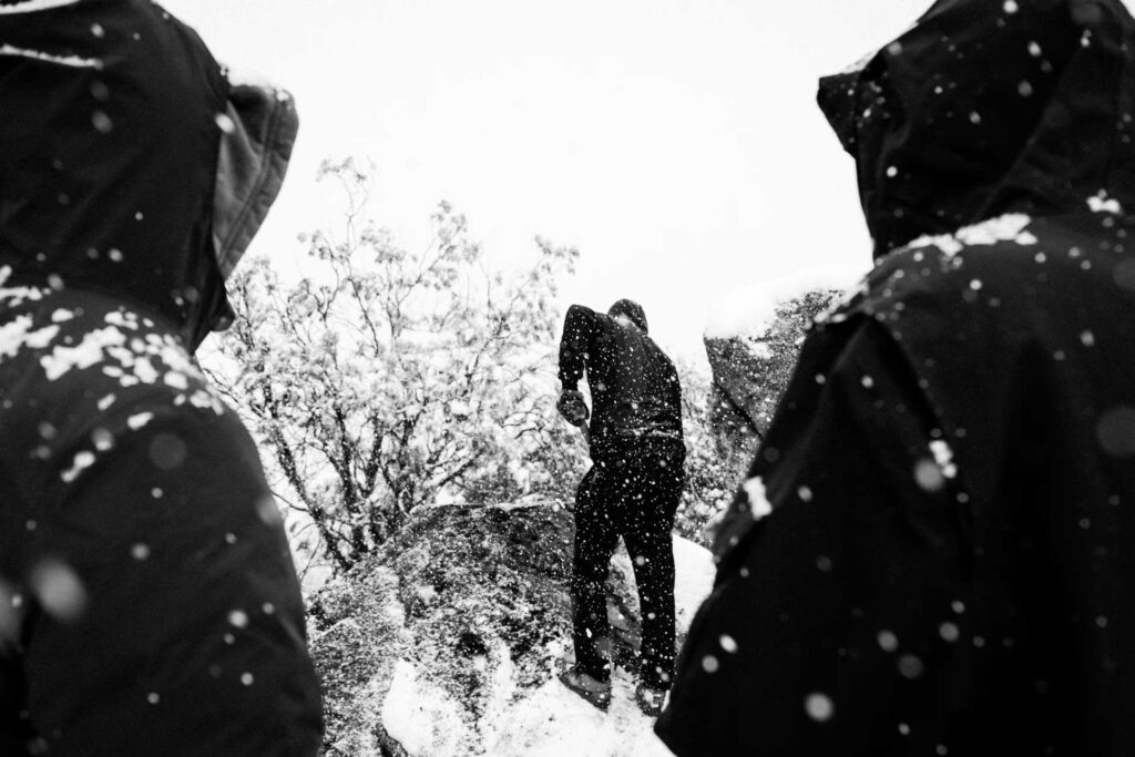 Man digging with shovel in snow