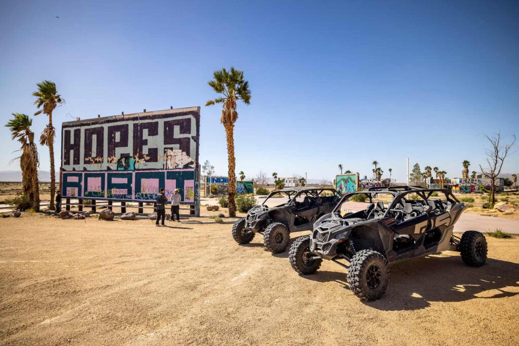two vehicles parked in the desert