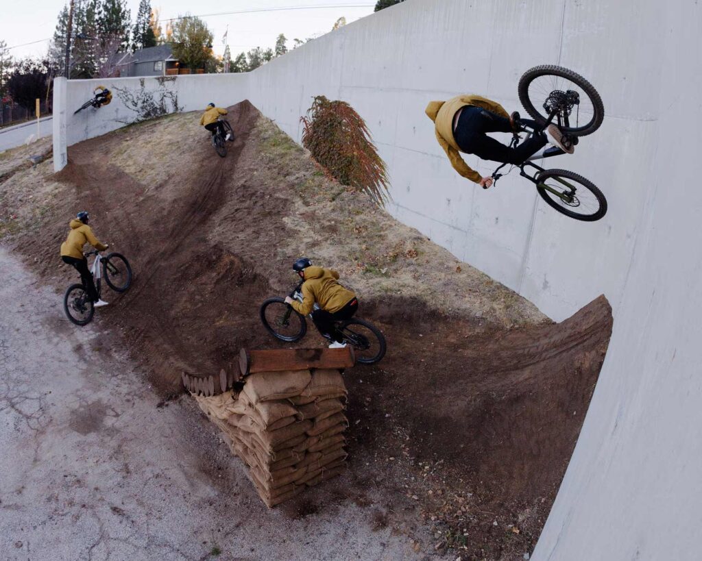 Creative image of mountain biker riding a corner wall spot