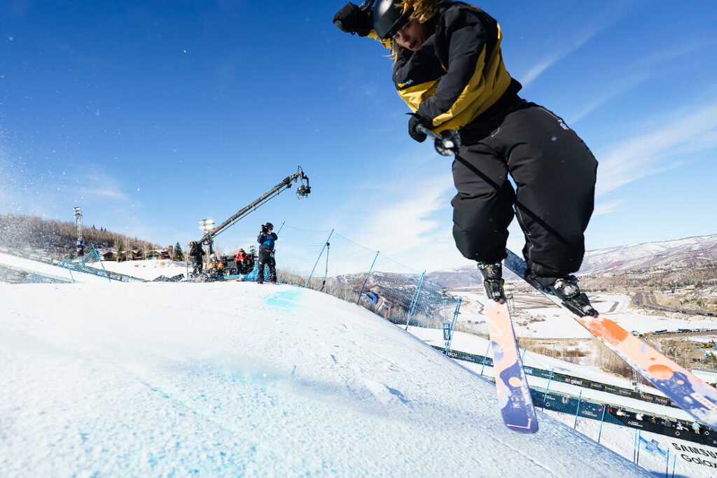 Trick skier in the air during a competition