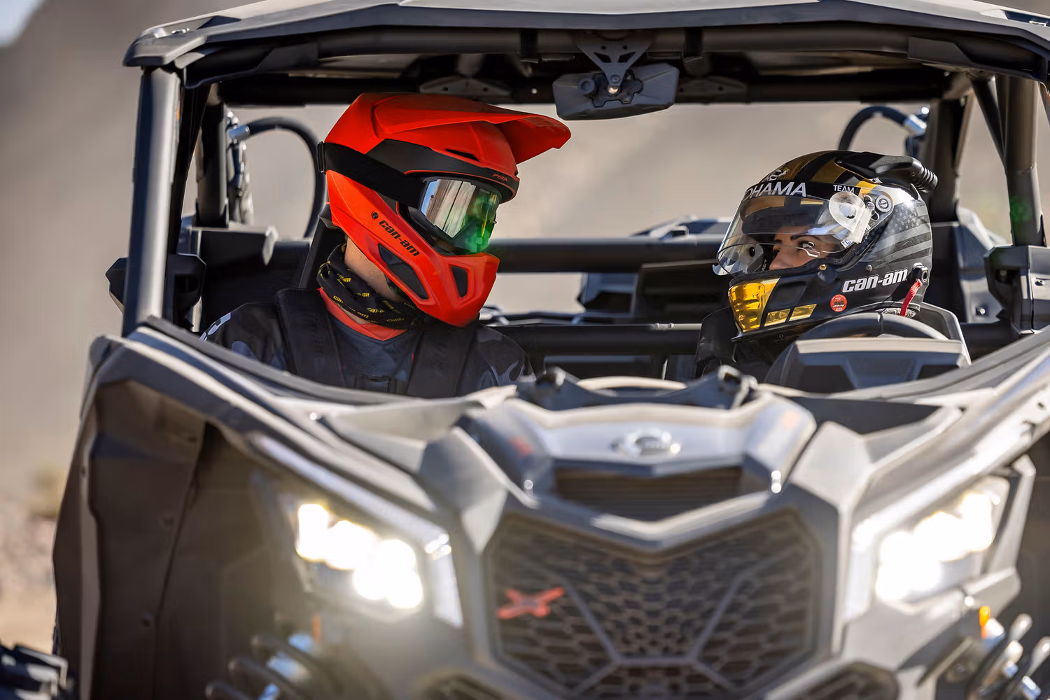 two people in a dune buggy