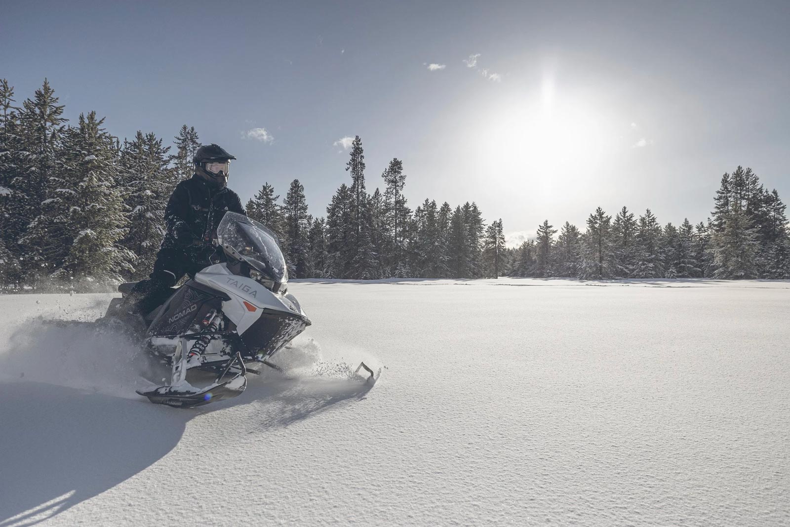 Snowmobile on sunny winter day