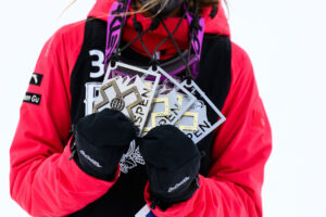 Winning athlete holding prizes