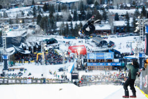 Eileen Gu high above the snow superpipe during Women's Ski SuperPipe Finals